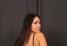 Kamila is dressed all in black today for a strip tease and pussy fingering